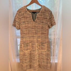 Tweed style work dress with pockets.